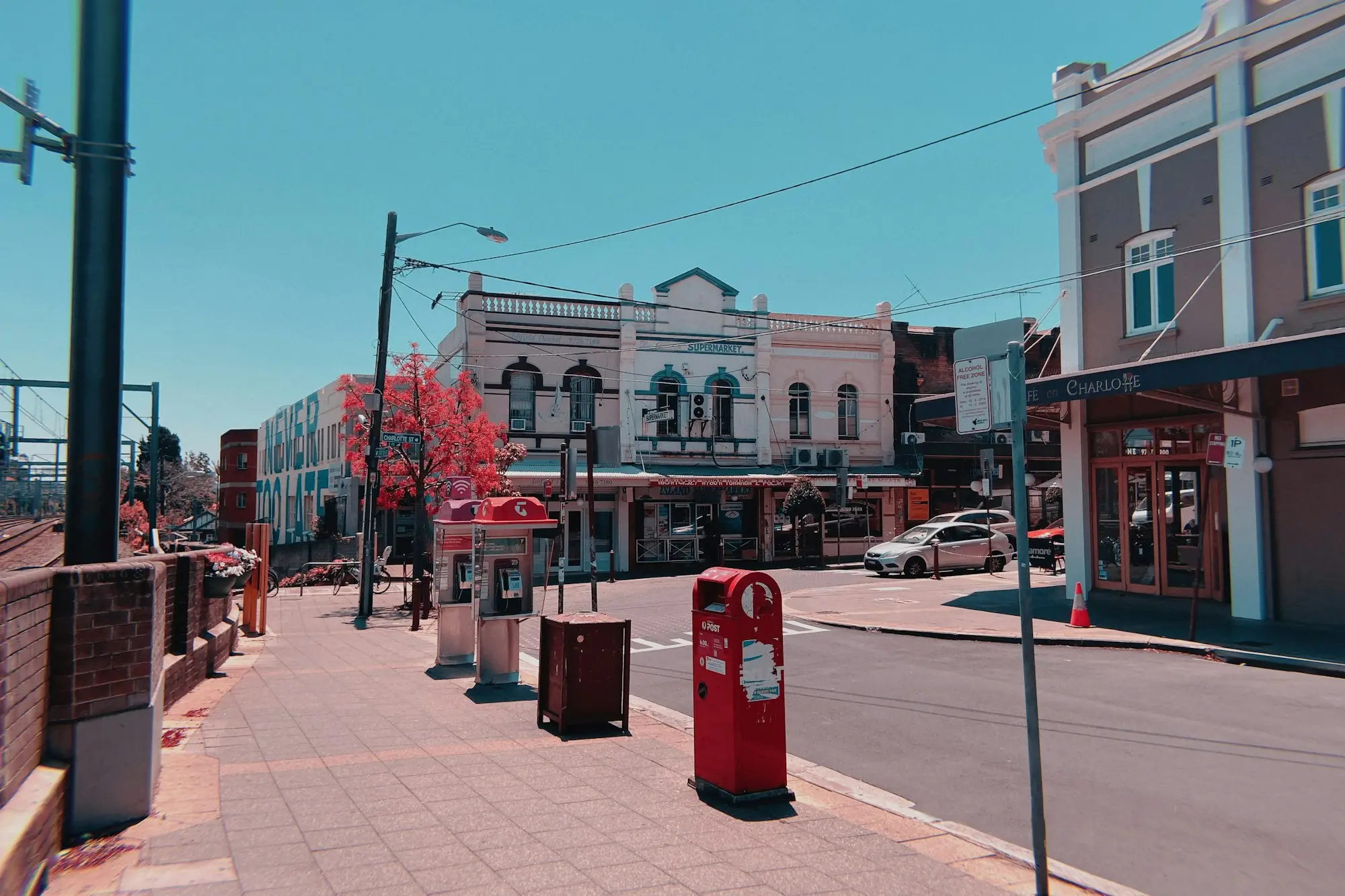 Main street shopfronts and red post boxes in an Australian country town