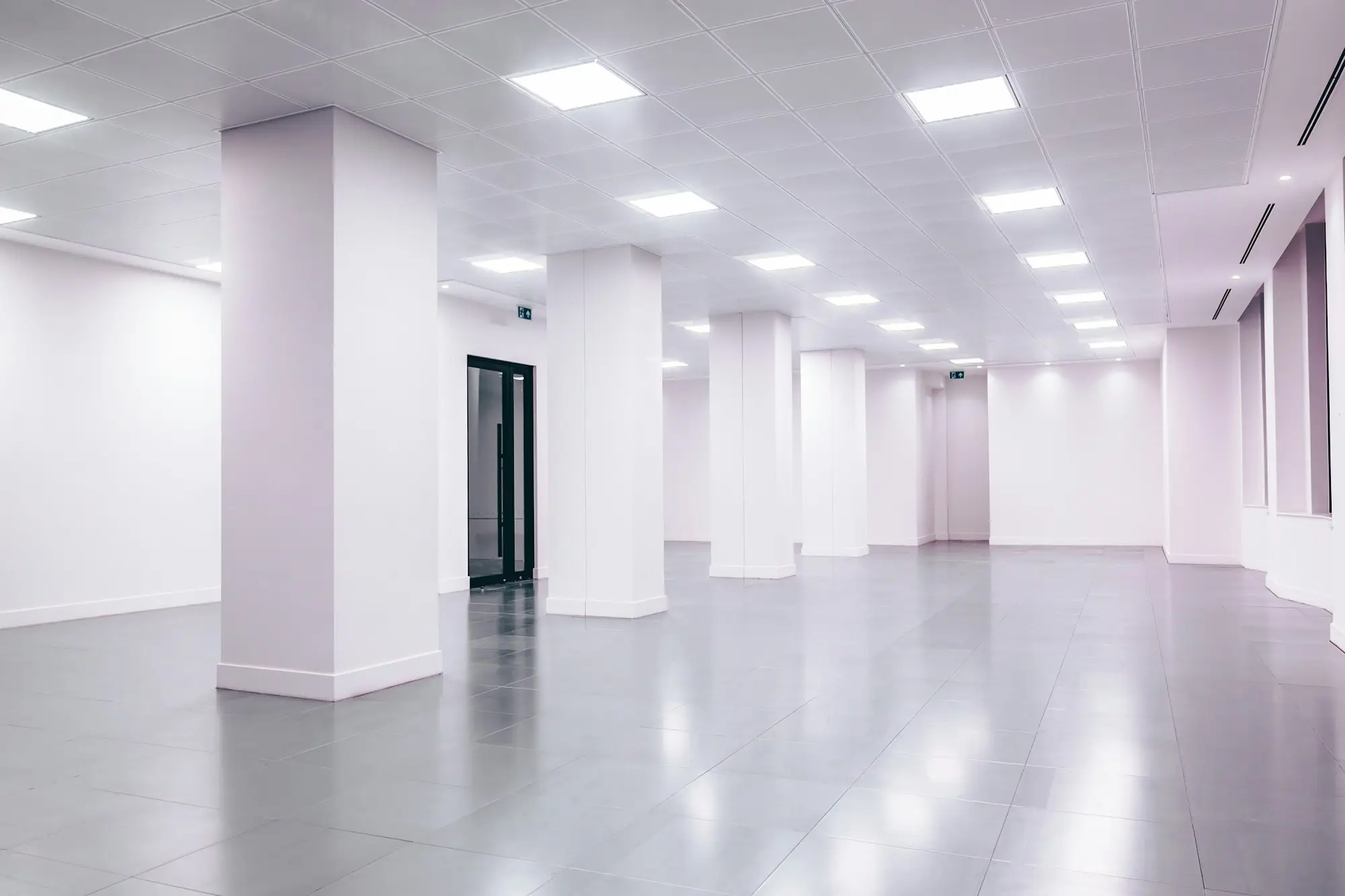 Empty commercial tenancy with white walls ready for a valuer's inspection