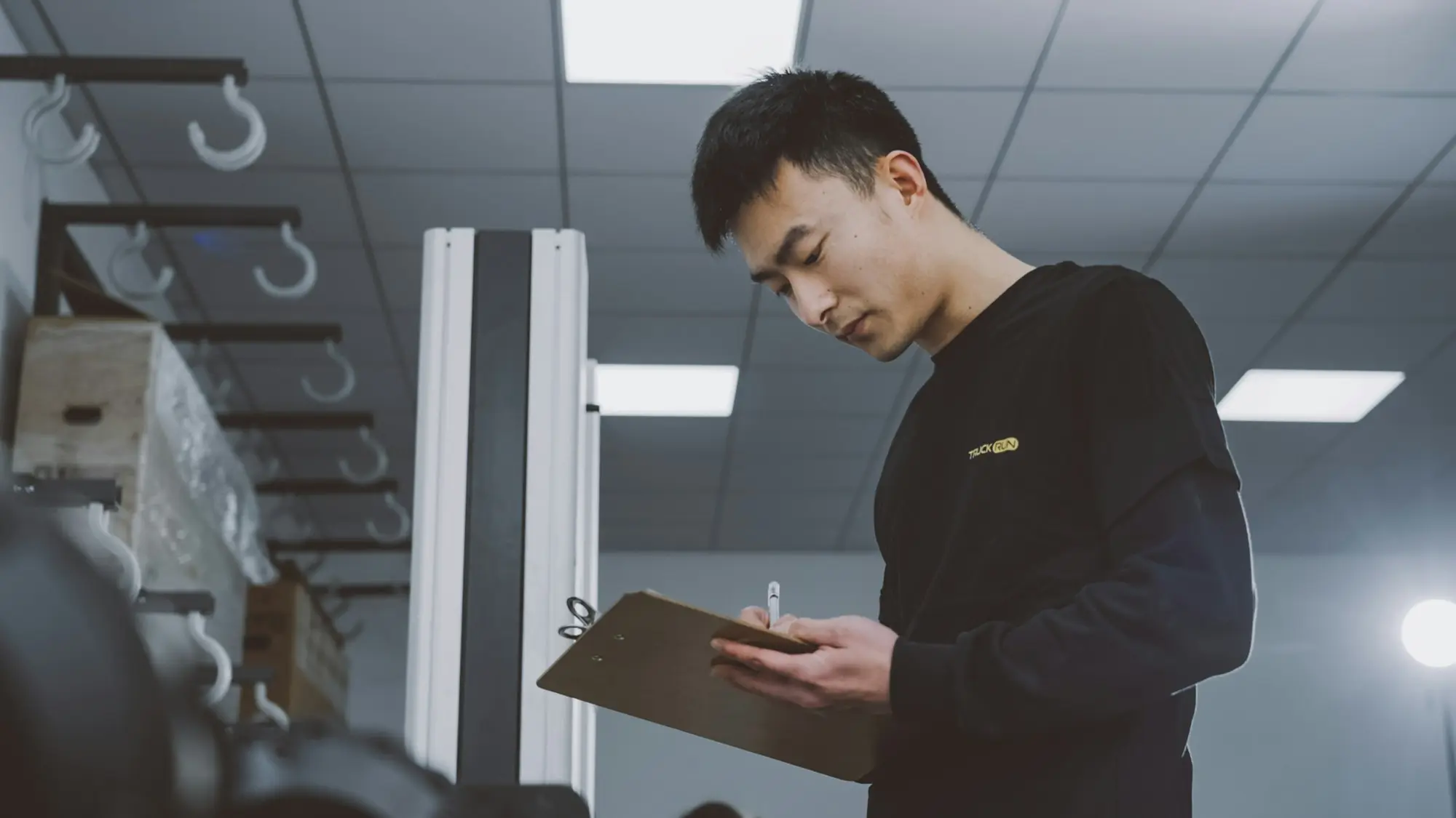 Property valuer holding a clipboard while inspecting a building for a short-term loan