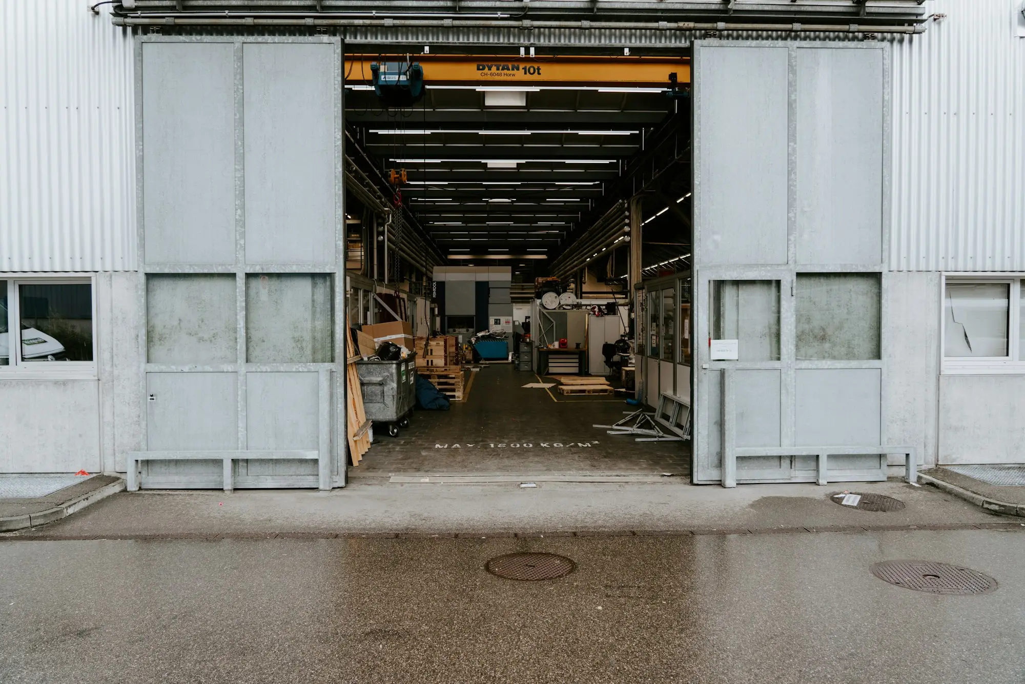 Industrial warehouse unit with its large sliding door open onto the loading area